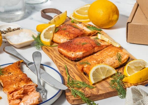 wild salmon cooked recipe-ready portions on board