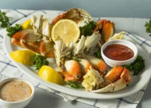Wild Dungeness Crab Leg Section with lemon and cocktail sauce
